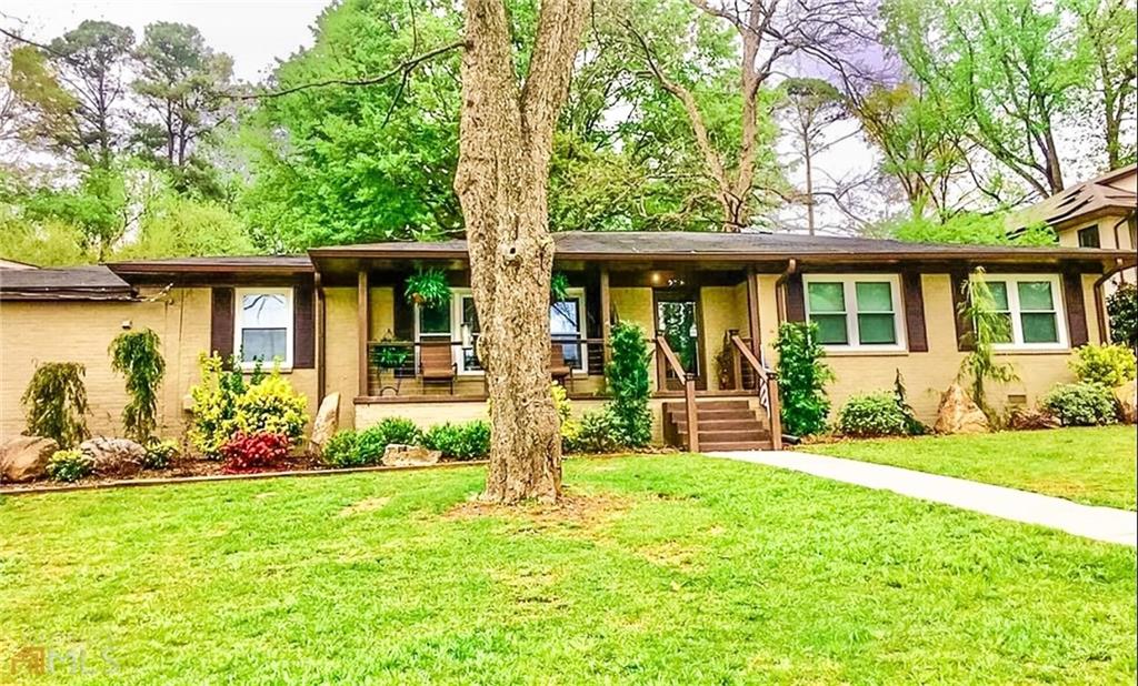 2858 Briarcliff Road Northeast Atlanta, GA 30329 - Photo 1 of 1 a front view of a house with garden