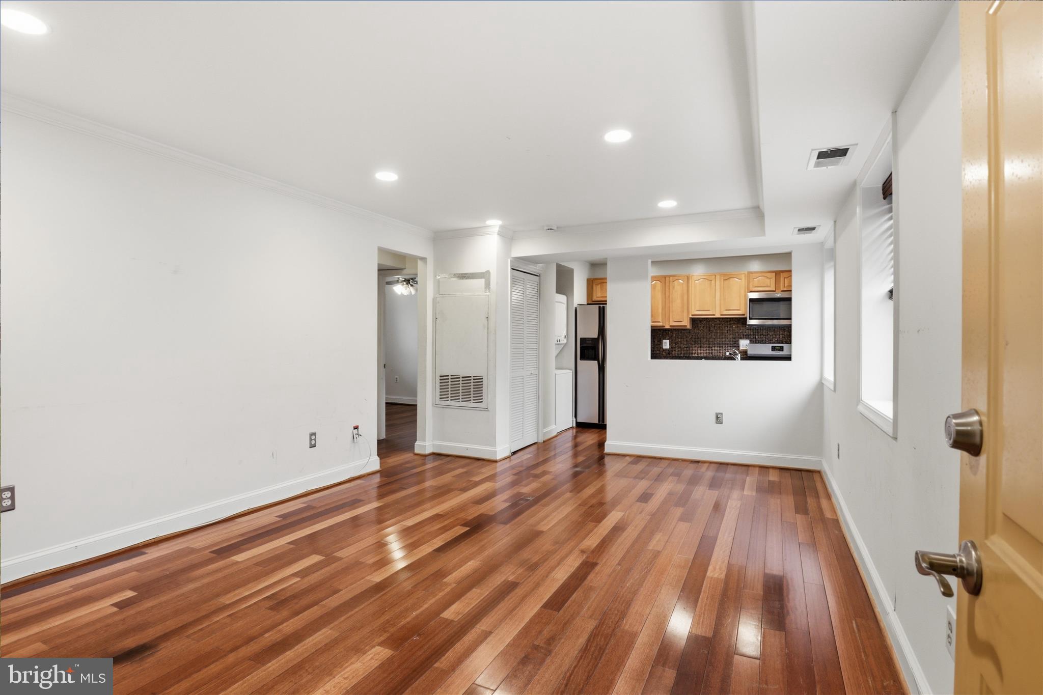 3866 9th Street Southeast, Unit 102 Washington, DC 20032 - Photo 2 of 21 a view of a room with wooden floor and window