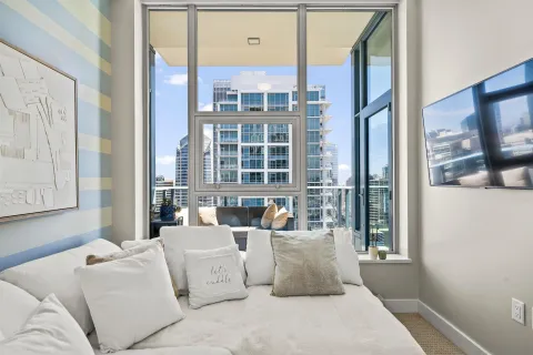 a living room with furniture and a large window