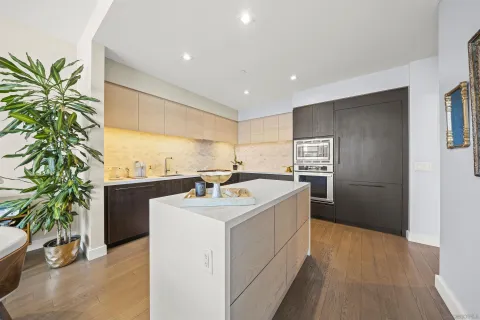 a kitchen with sink a faucet and appliances