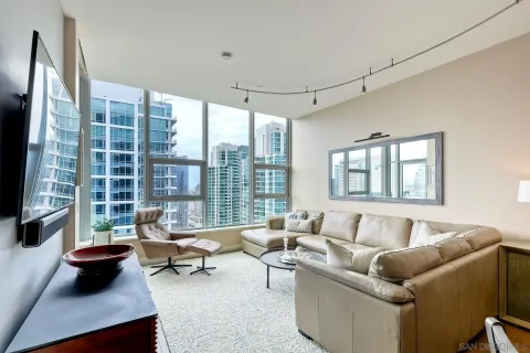 a living room with furniture and a large window