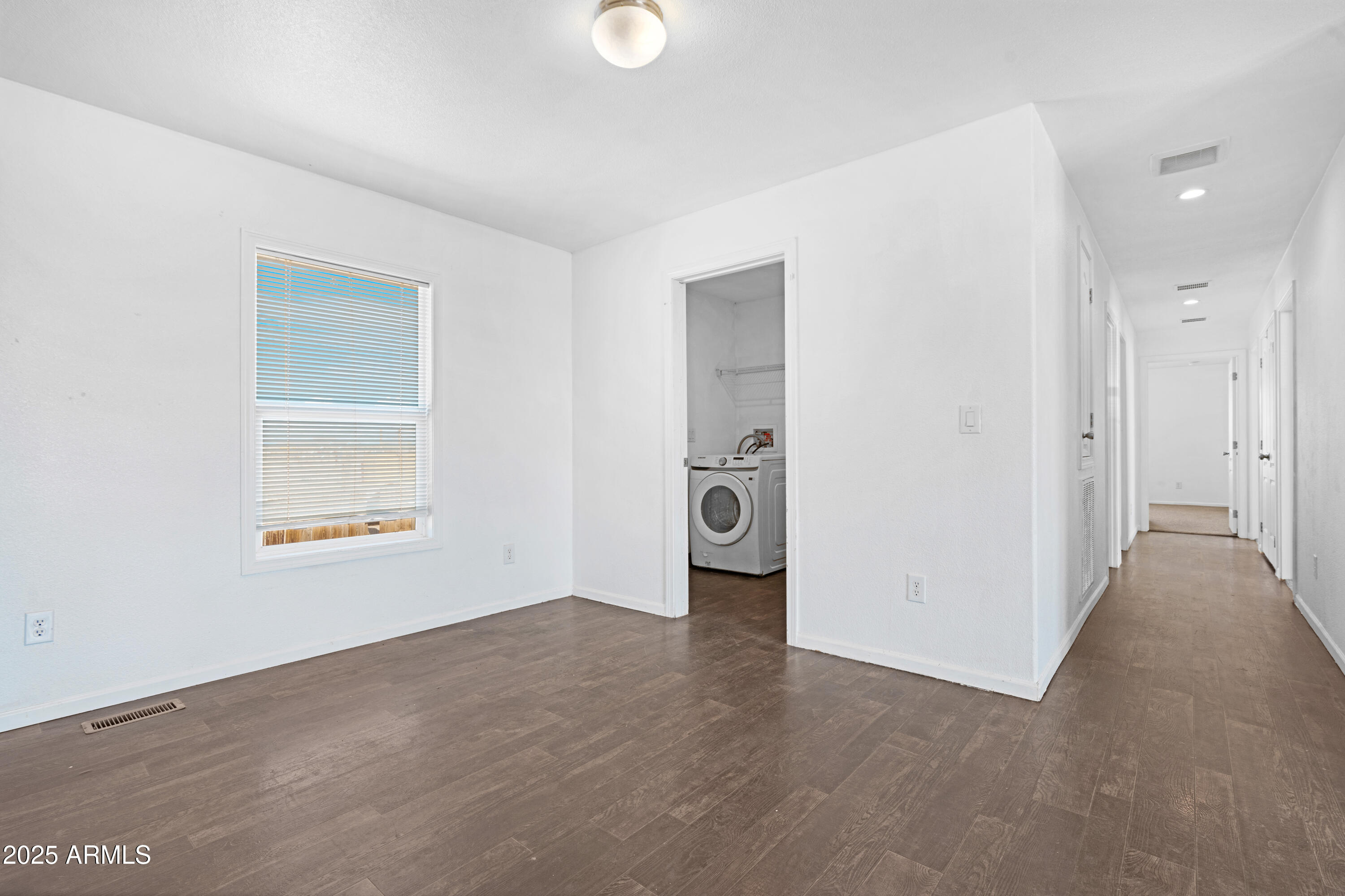 4318 North White Road Maricopa, AZ 85139 - Photo 16 of 21 a view of an empty room with a window