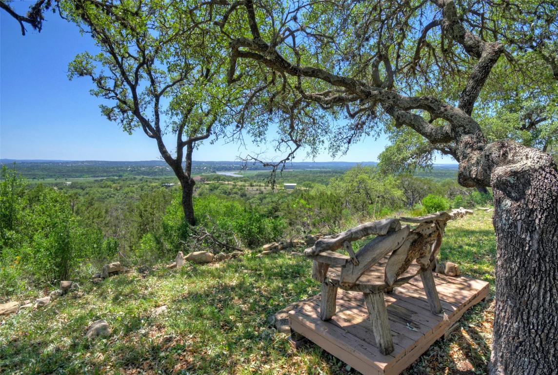 Stellar hill country views in several directions, including a portion of Lake Travis in the distance