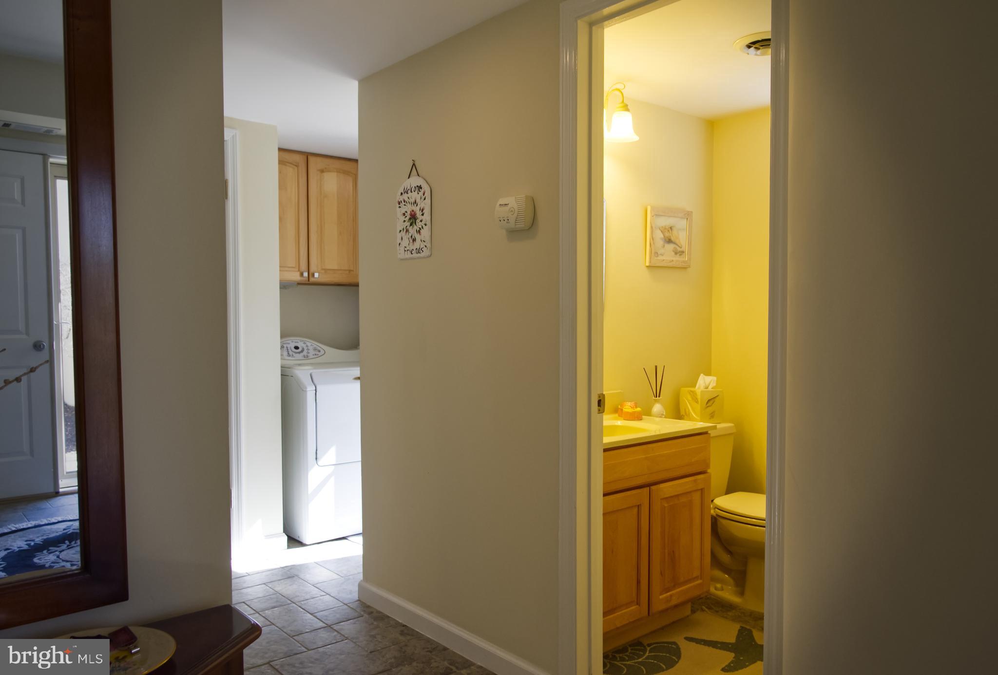 5 Greate Bay Drive Somers Point, NJ 08244 - Photo 11 of 62 a bathroom with a sink and a mirror