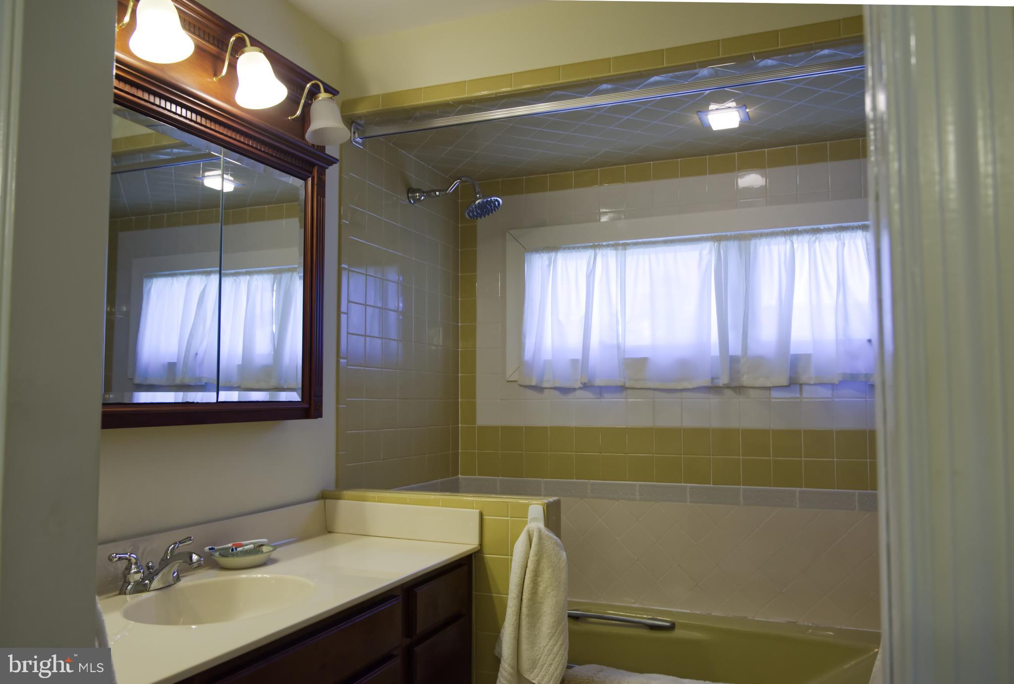 5 Greate Bay Drive Somers Point, NJ 08244 - Photo 17 of 62 a bathroom with a sink and a mirror