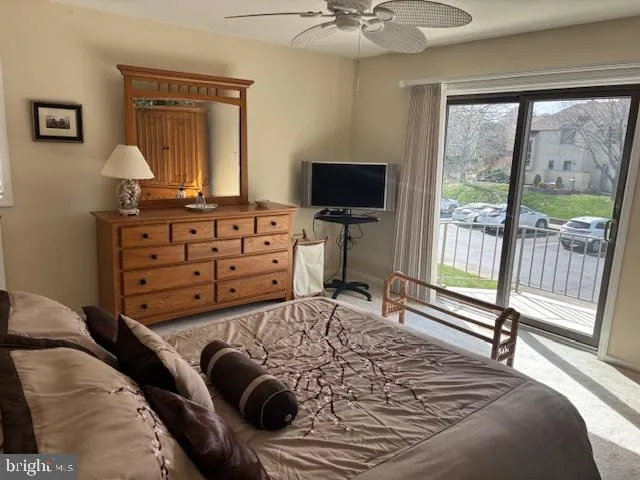 a bathroom with a toilet a sink and a mirror