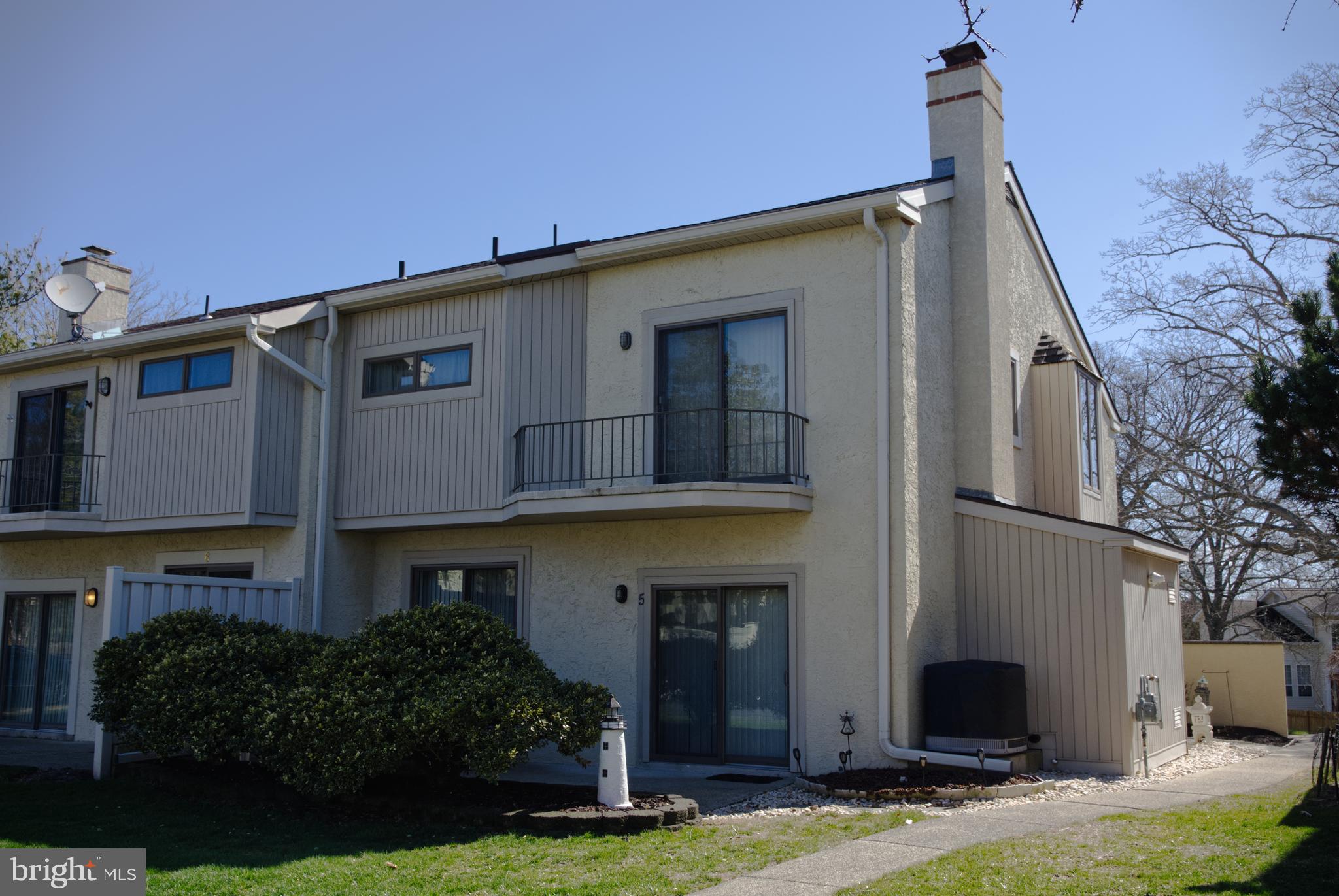 5 Greate Bay Drive Somers Point, NJ 08244 - Photo 4 of 62 a front view of a house with garden