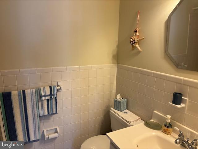 5 Greate Bay Drive Somers Point, NJ 08244 - Photo 44 of 62 a bathroom with a sink a toilet and a mirror