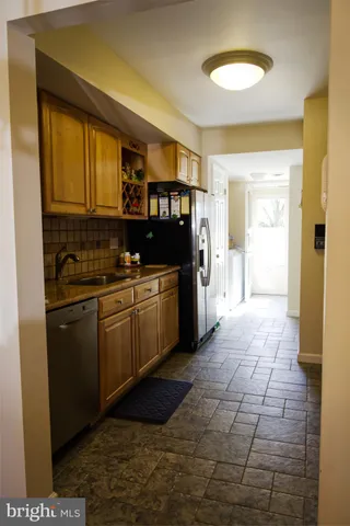 a view of a dining room with furniture and window