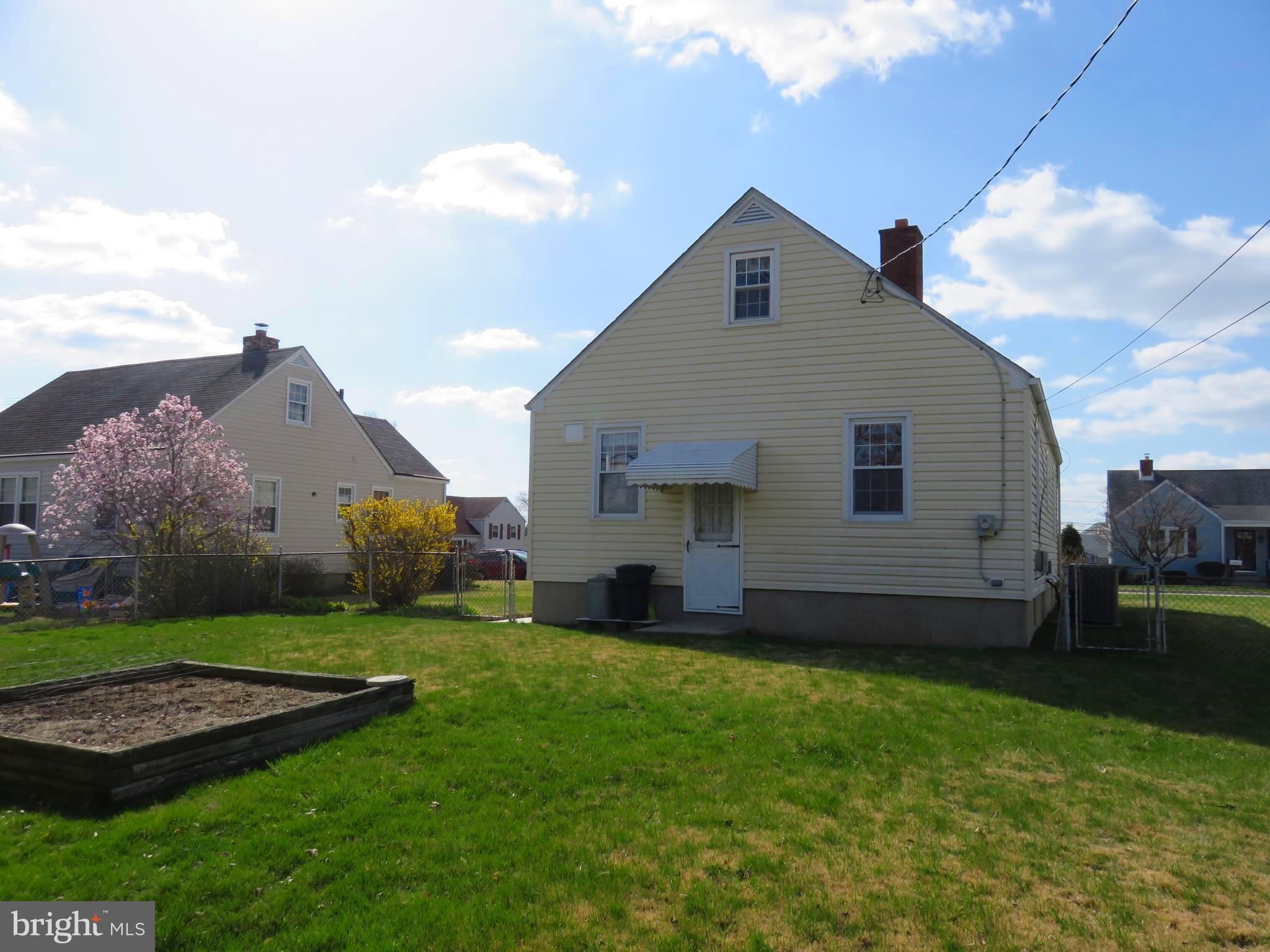 1804 Forrest Road Baltimore, MD 21234 - Photo 2 of 25 a view of a backyard with plants and a garden