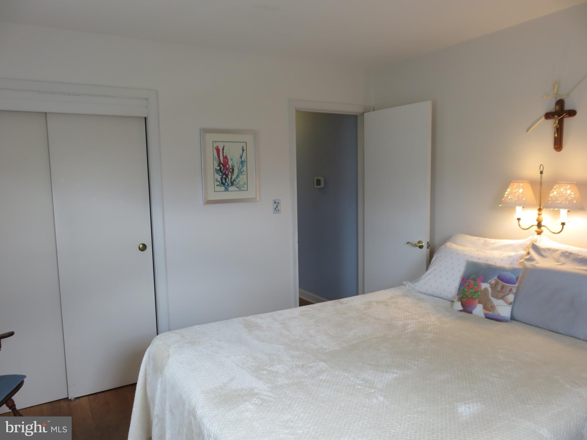 1804 Forrest Road Baltimore, MD 21234 - Photo 11 of 25 a bedroom with a bed and a lamp