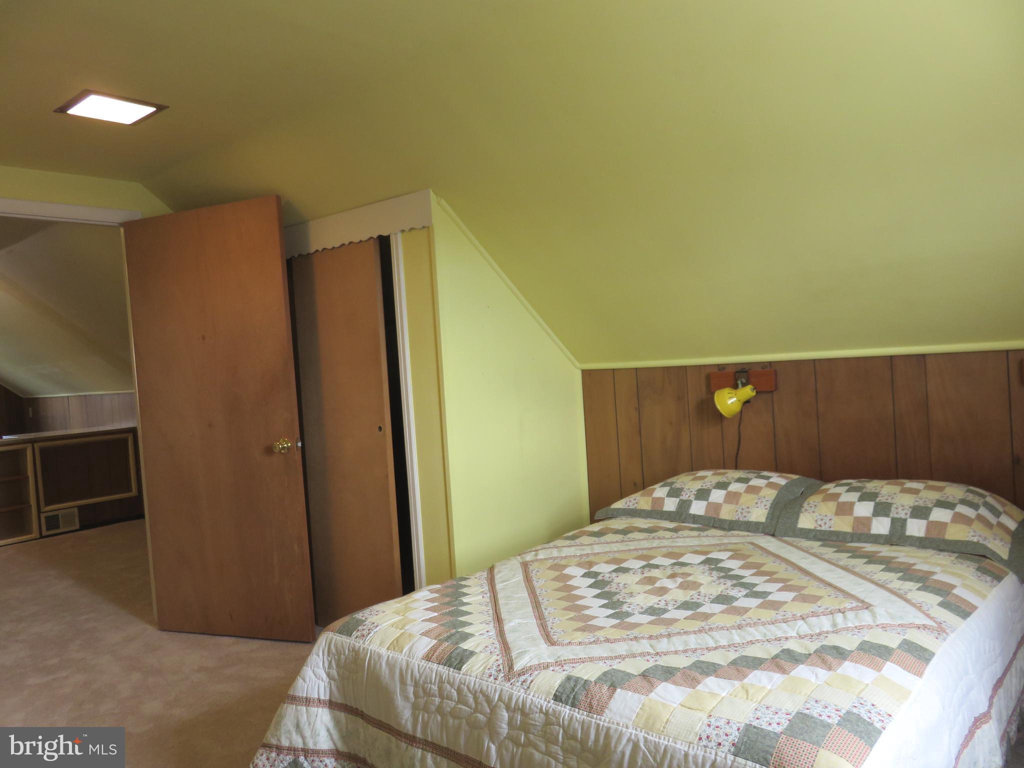 1804 Forrest Road Baltimore, MD 21234 - Photo 15 of 25 a bedroom with a bed and wooden floor