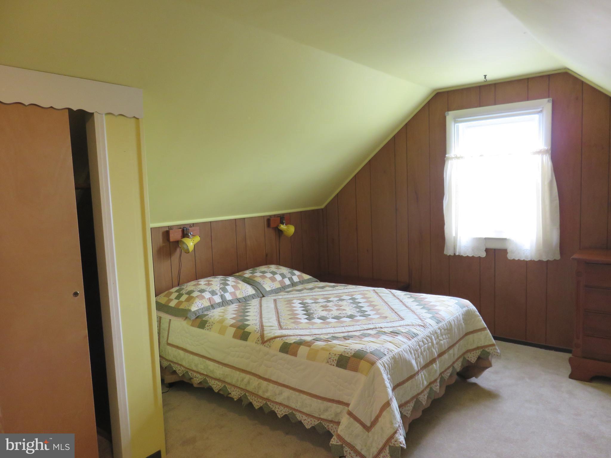 1804 Forrest Road Baltimore, MD 21234 - Photo 16 of 25 a bed sitting in a bedroom next to a window