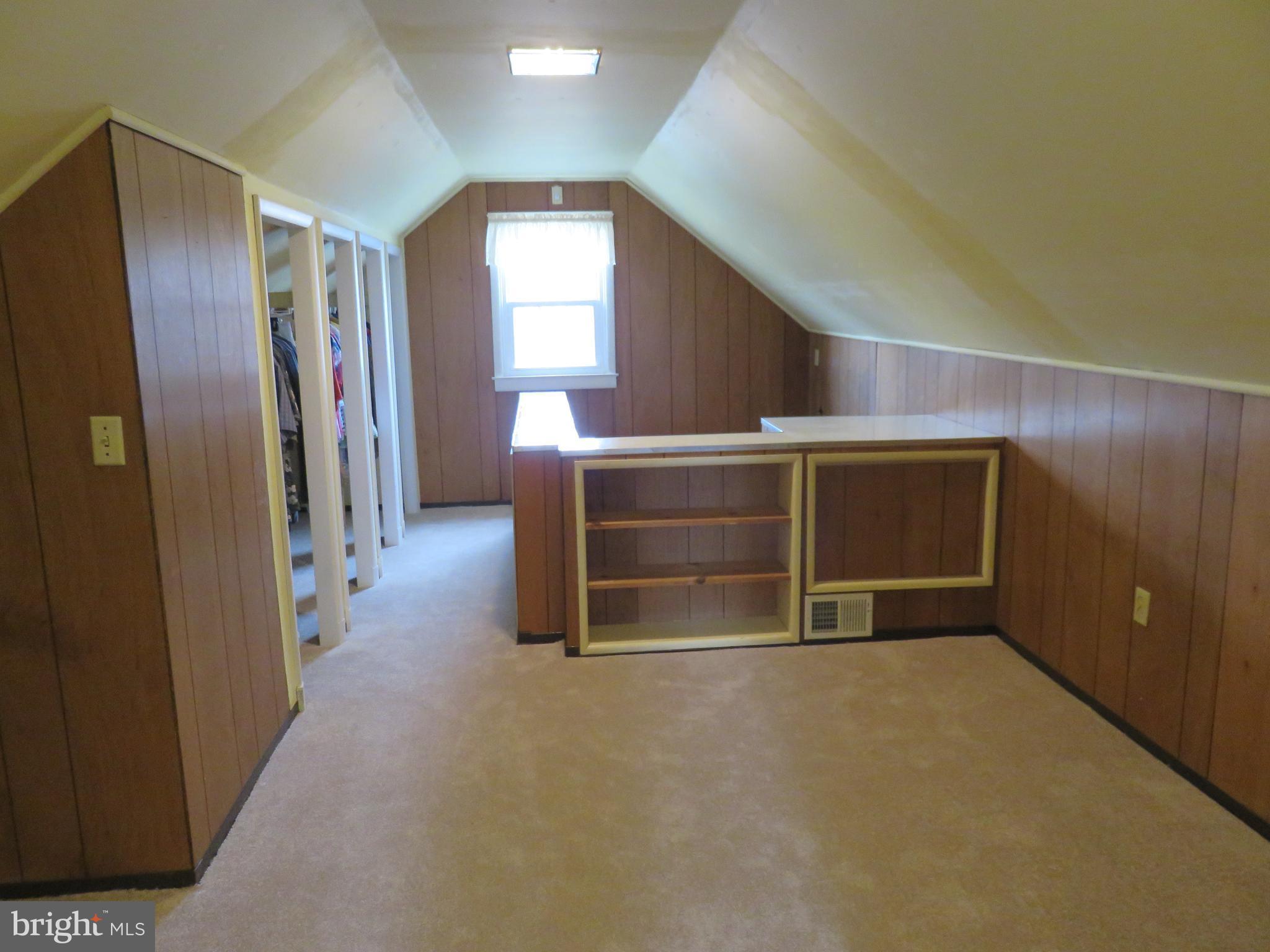 1804 Forrest Road Baltimore, MD 21234 - Photo 17 of 25 a view of an empty room with wooden walls and windows