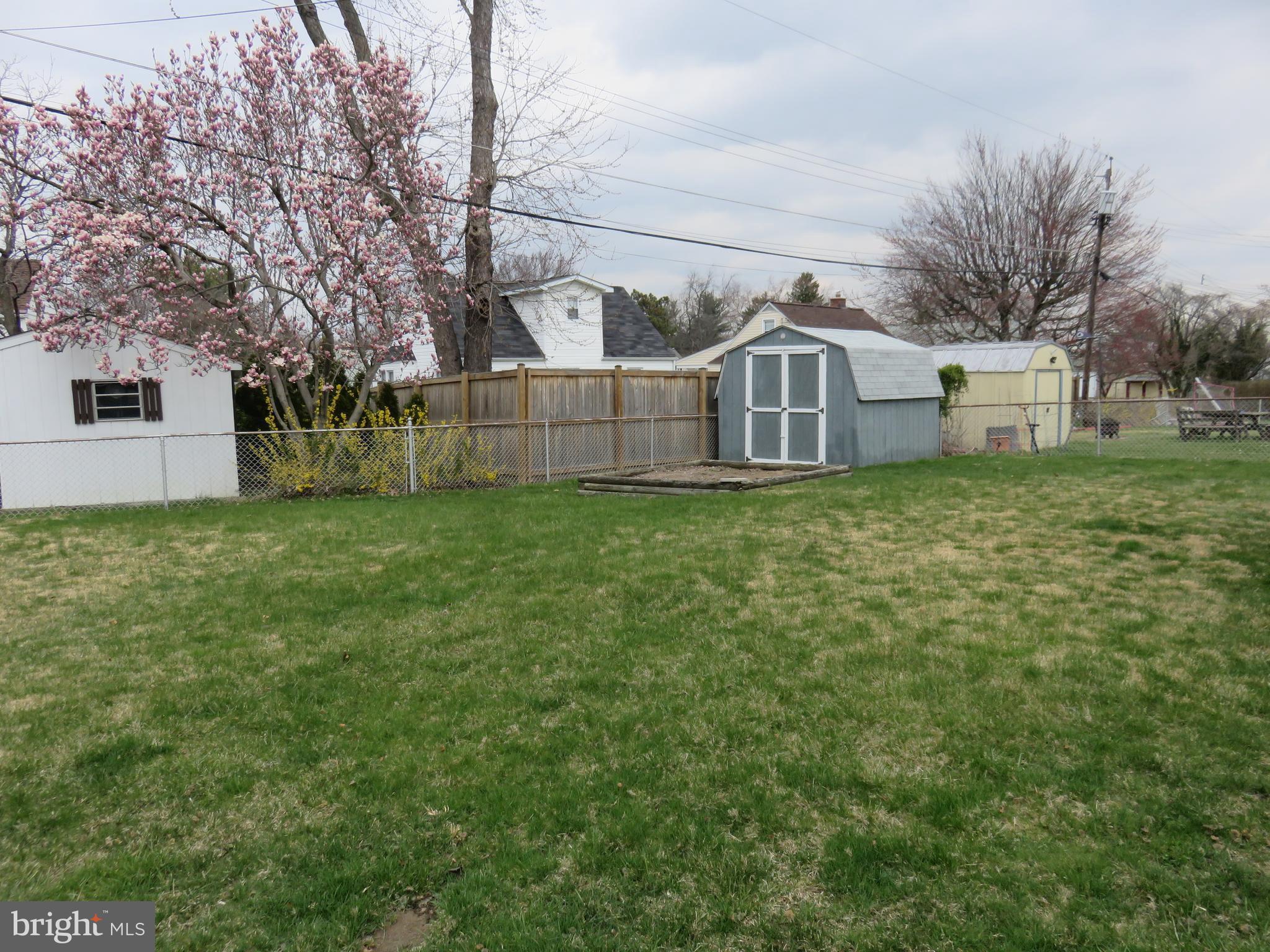1804 Forrest Road Baltimore, MD 21234 - Photo 20 of 25 a white house that has a big yard and large trees