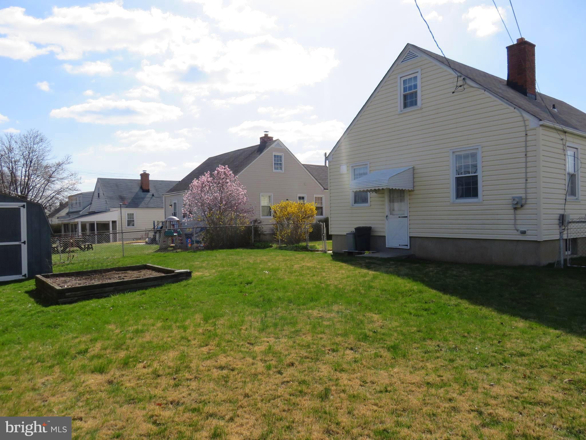 1804 Forrest Road Baltimore, MD 21234 - Photo 22 of 25 a view of an house with backyard space and garden