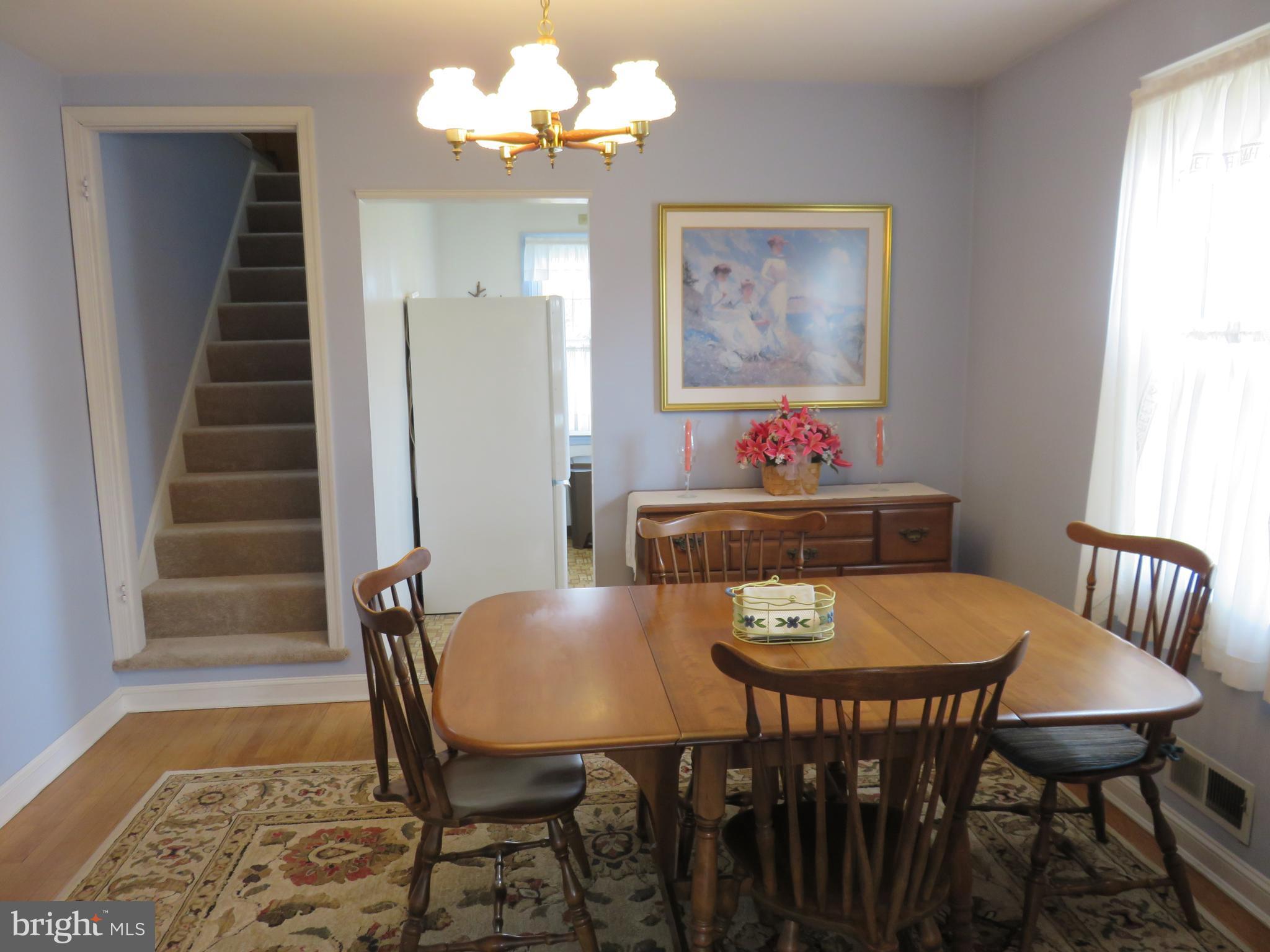 1804 Forrest Road Baltimore, MD 21234 - Photo 4 of 25 a view of a dining room with furniture and wooden floor