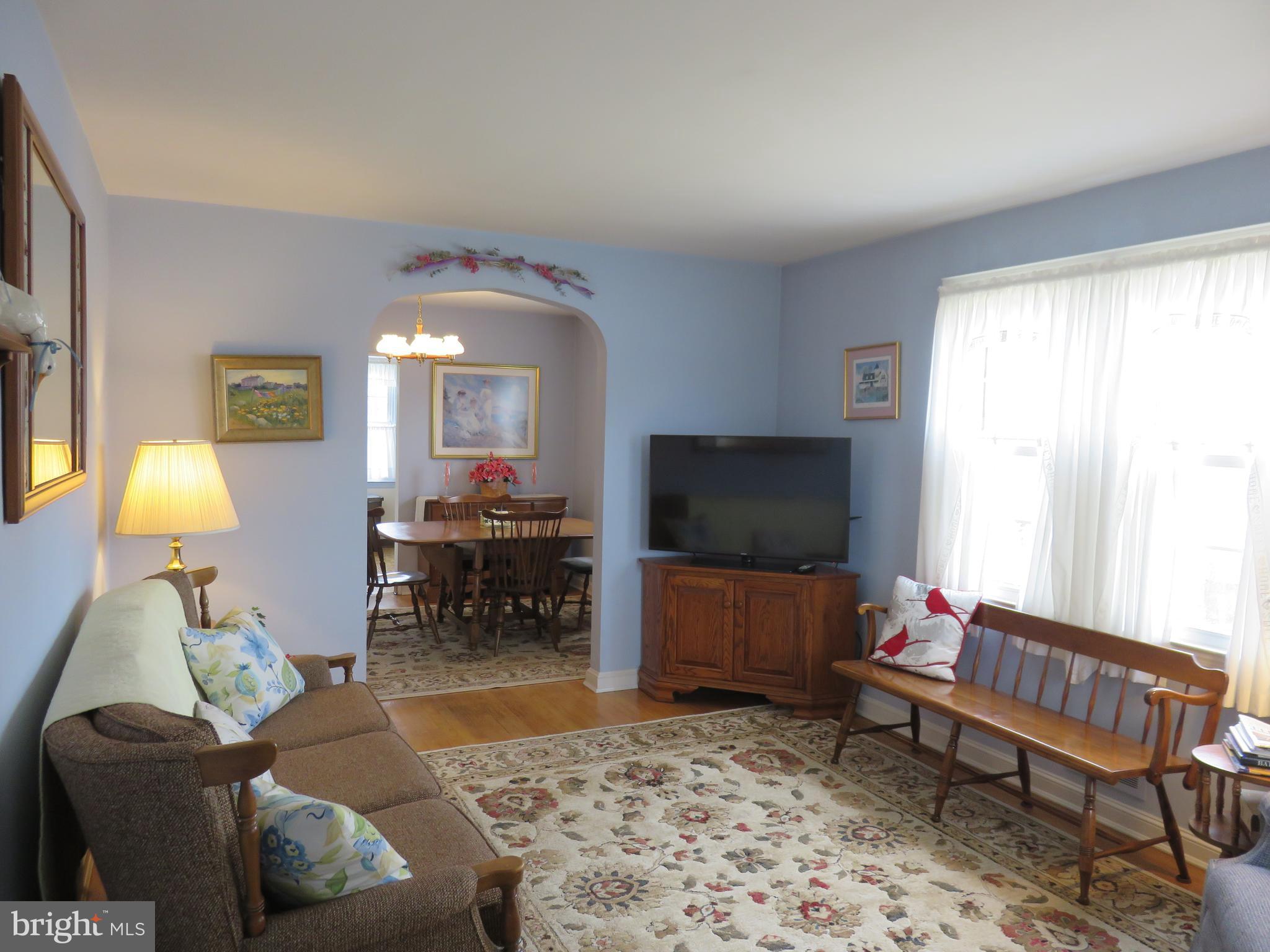 1804 Forrest Road Baltimore, MD 21234 - Photo 5 of 25 a living room with furniture and a flat screen tv