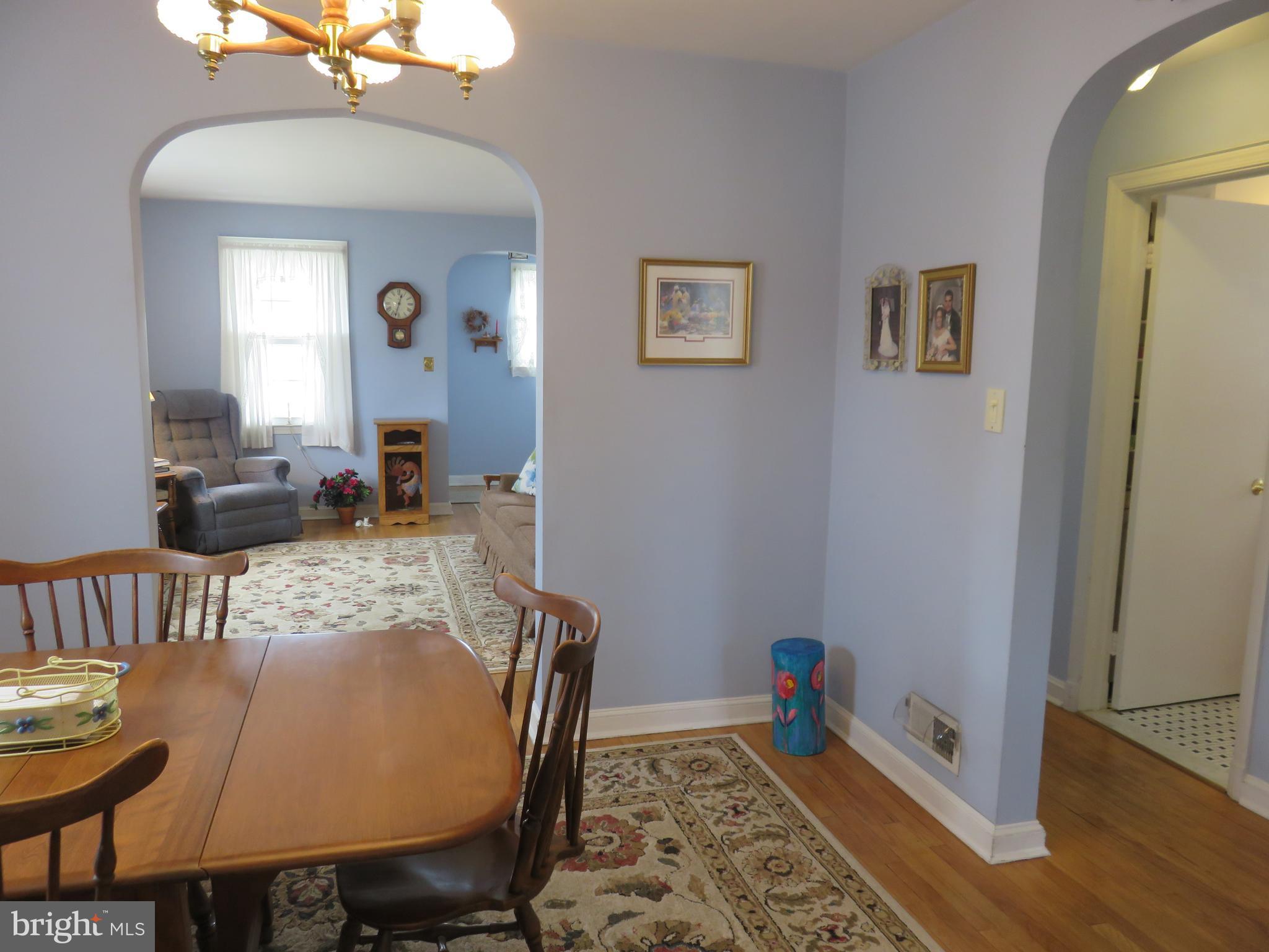 1804 Forrest Road Baltimore, MD 21234 - Photo 6 of 25 a view of a dining room with furniture and wooden floor
