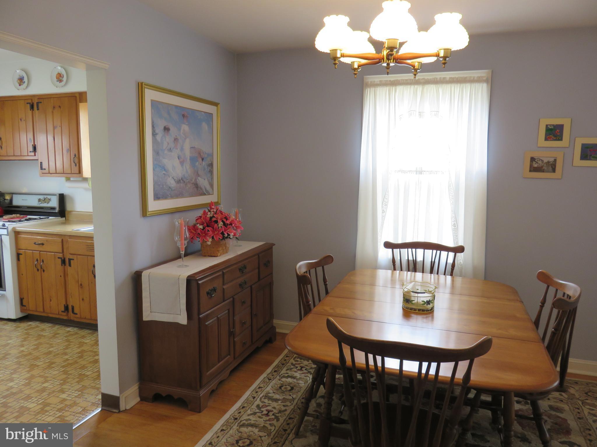 1804 Forrest Road Baltimore, MD 21234 - Photo 7 of 25 a view of a dining room with furniture window and wooden floor