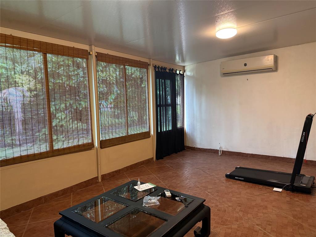 8121 Southwest 8th Street North Lauderdale, FL 33068 - Photo 12 of 16 a room with furniture and a window