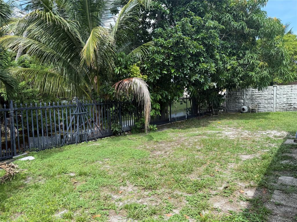 8121 Southwest 8th Street North Lauderdale, FL 33068 - Photo 14 of 16 a view of a backyard with a trees