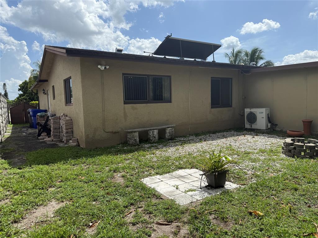 8121 Southwest 8th Street North Lauderdale, FL 33068 - Photo 15 of 16 a backyard of a house with lots of green space