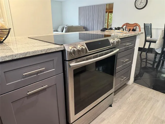 a kitchen with a stove and a microwave