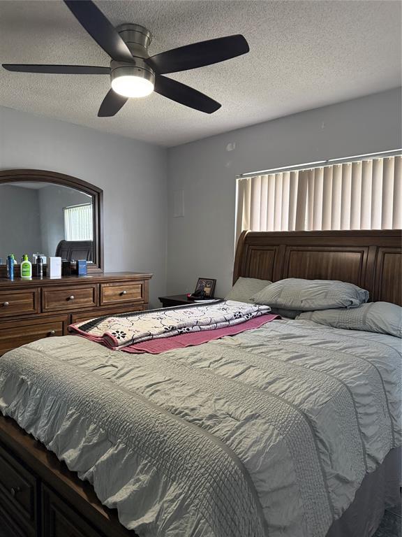 8121 Southwest 8th Street North Lauderdale, FL 33068 - Photo 5 of 16 a bedroom with a bed and a dresser
