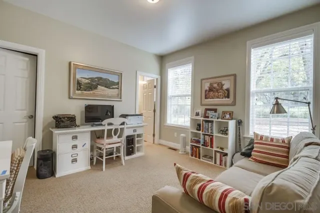 a view of a hallway with windows