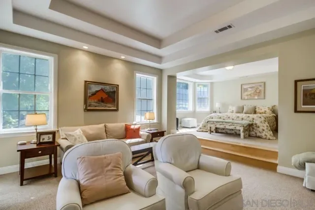 a bathroom with a tub and window