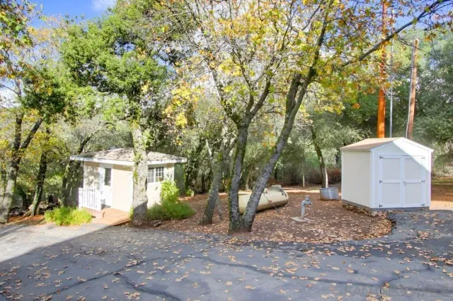 a view of a house with a yard and garage
