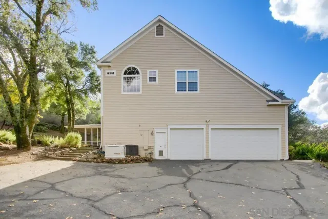 a view of backyard with green space