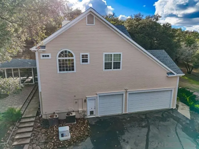 a view of a large yard with lots of green space