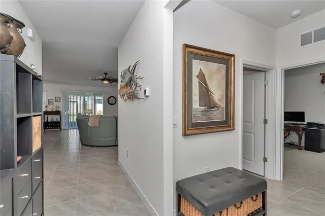 a kitchen with granite countertop stainless steel appliances a sink a stove cabinets counter space and a window