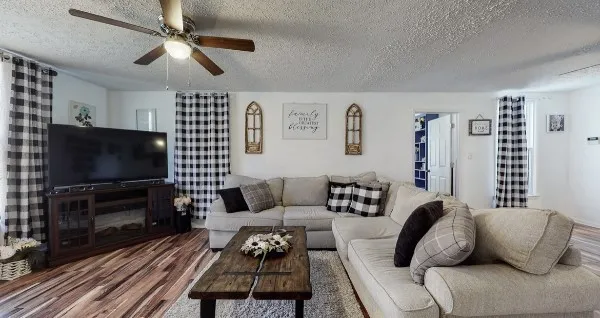 a living room with furniture and a window