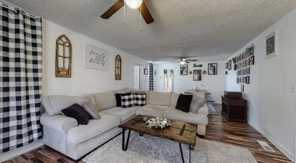 a bedroom that has a bed and a chandelier