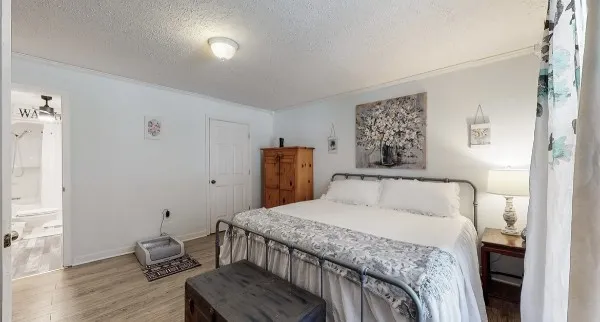 a spacious bathroom with a shower sink and mirror