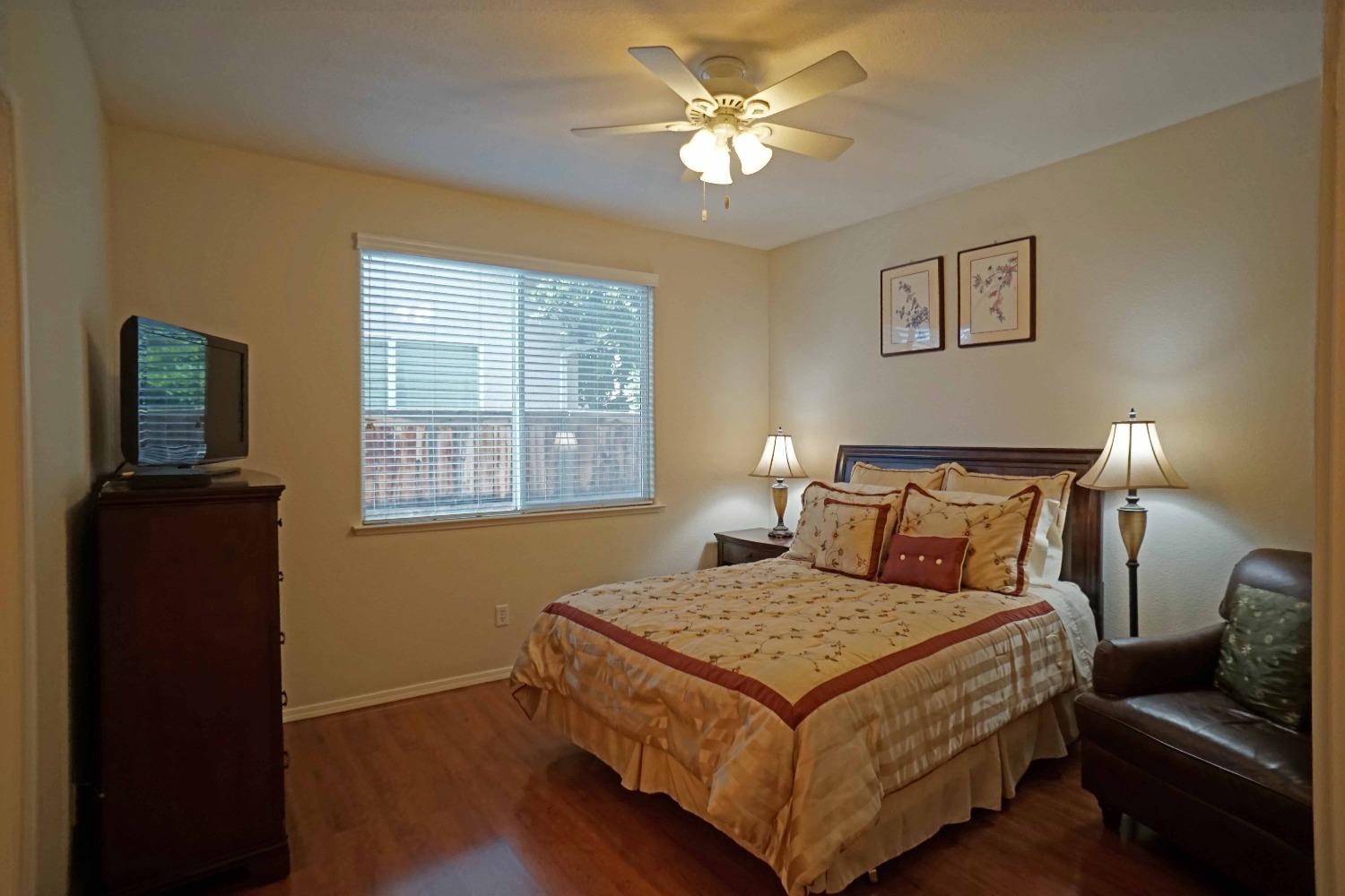 618 West Lisbon Lane Clovis, CA 93619 - Photo 15 of 26 a bedroom with a bed and a window