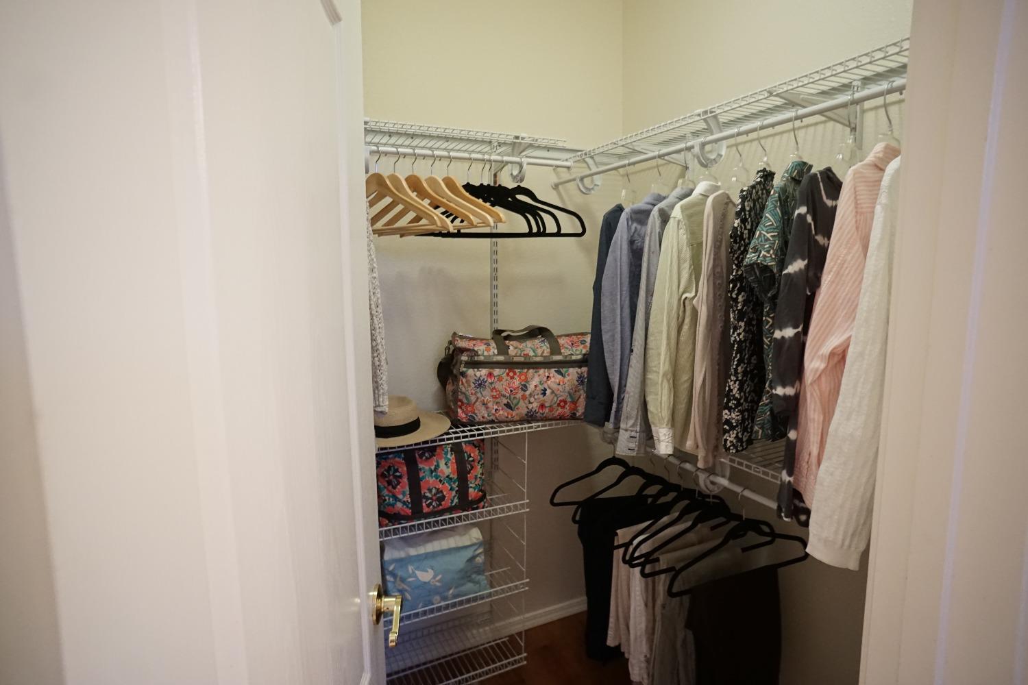 618 West Lisbon Lane Clovis, CA 93619 - Photo 18 of 26 a view of walk in closet with clothes and shoes