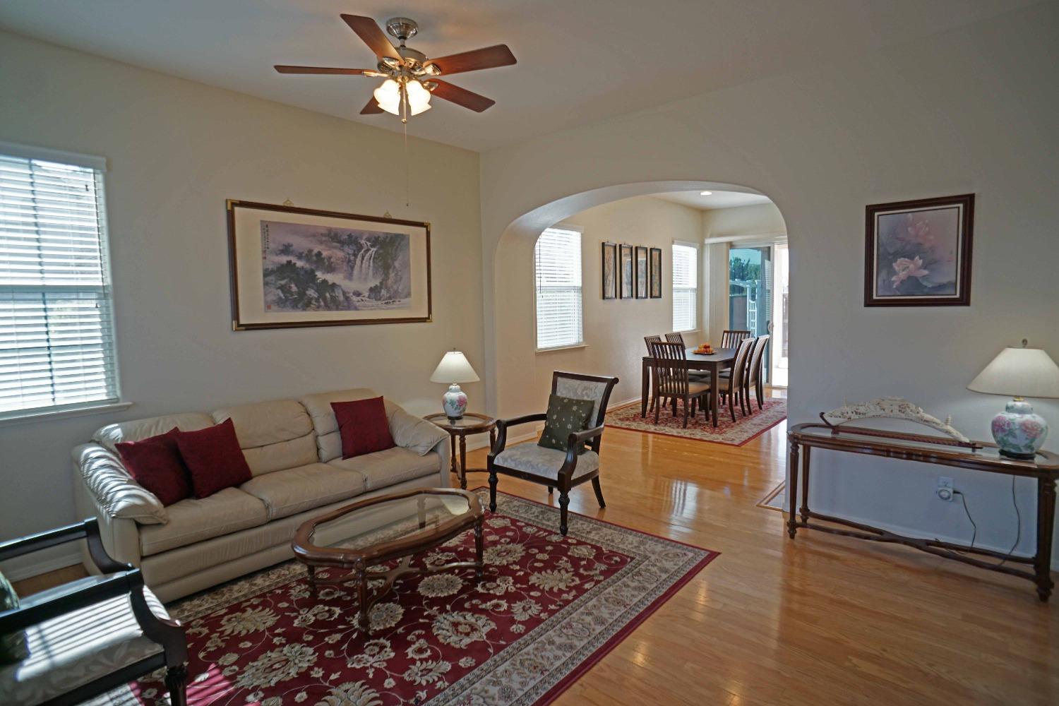 618 West Lisbon Lane Clovis, CA 93619 - Photo 2 of 26 a living room with furniture and a wooden floor