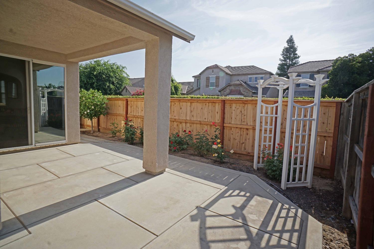 618 West Lisbon Lane Clovis, CA 93619 - Photo 21 of 26 a view of a house with backyard and porch