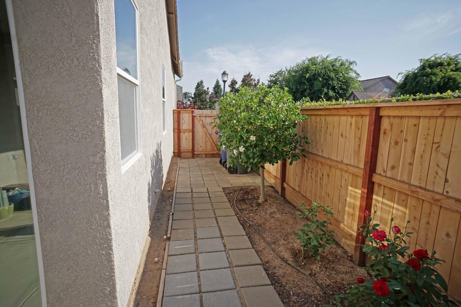 618 West Lisbon Lane Clovis, CA 93619 - Photo 24 of 26 a view of a pathway with a house