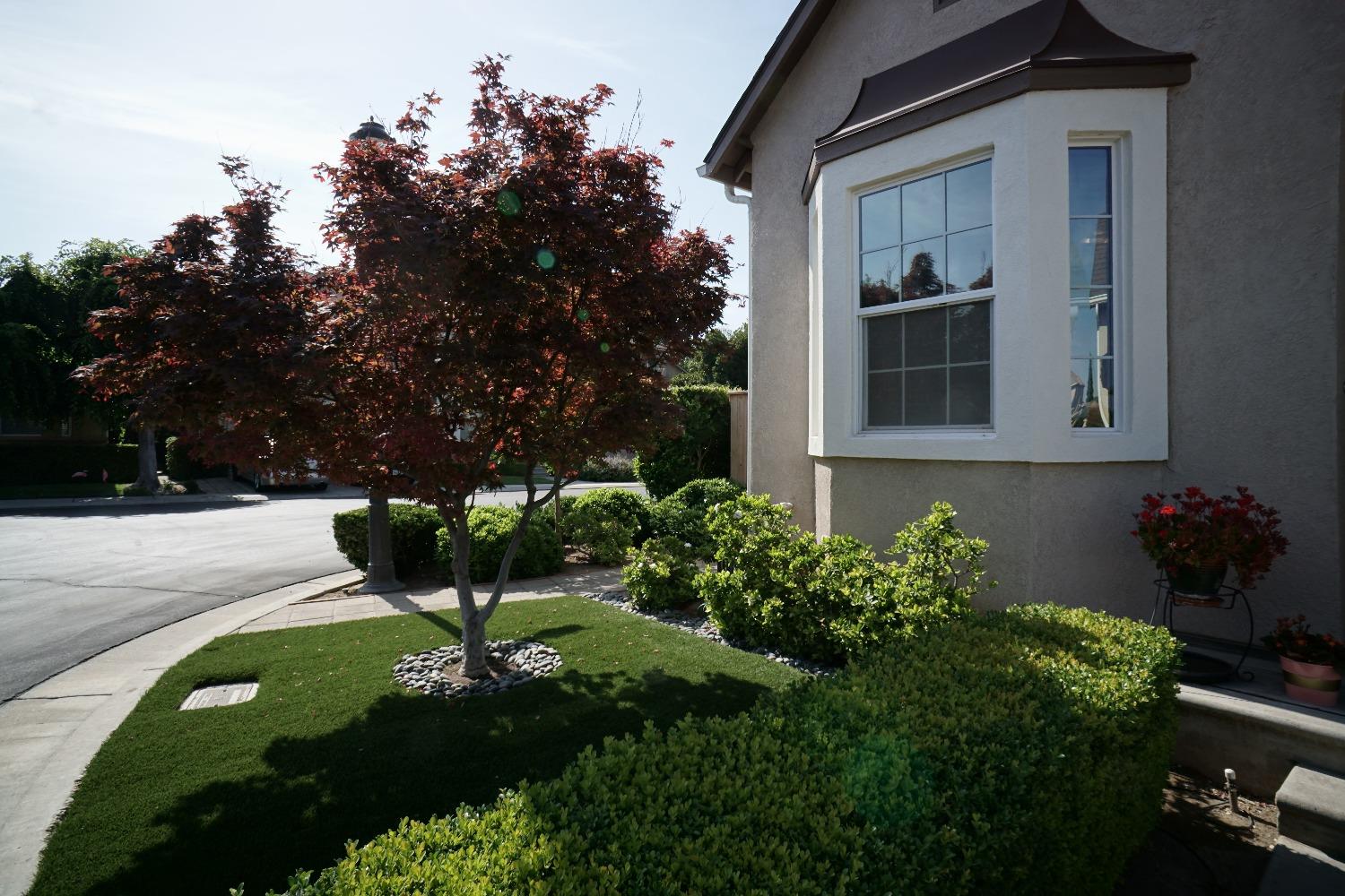 618 West Lisbon Lane Clovis, CA 93619 - Photo 25 of 26 a front view of a house with a yard