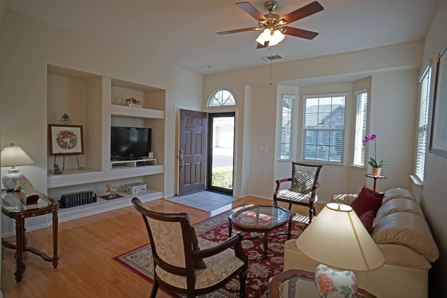 618 West Lisbon Lane Clovis, CA 93619 - Photo 4 of 26 a living room with furniture and a flat screen tv