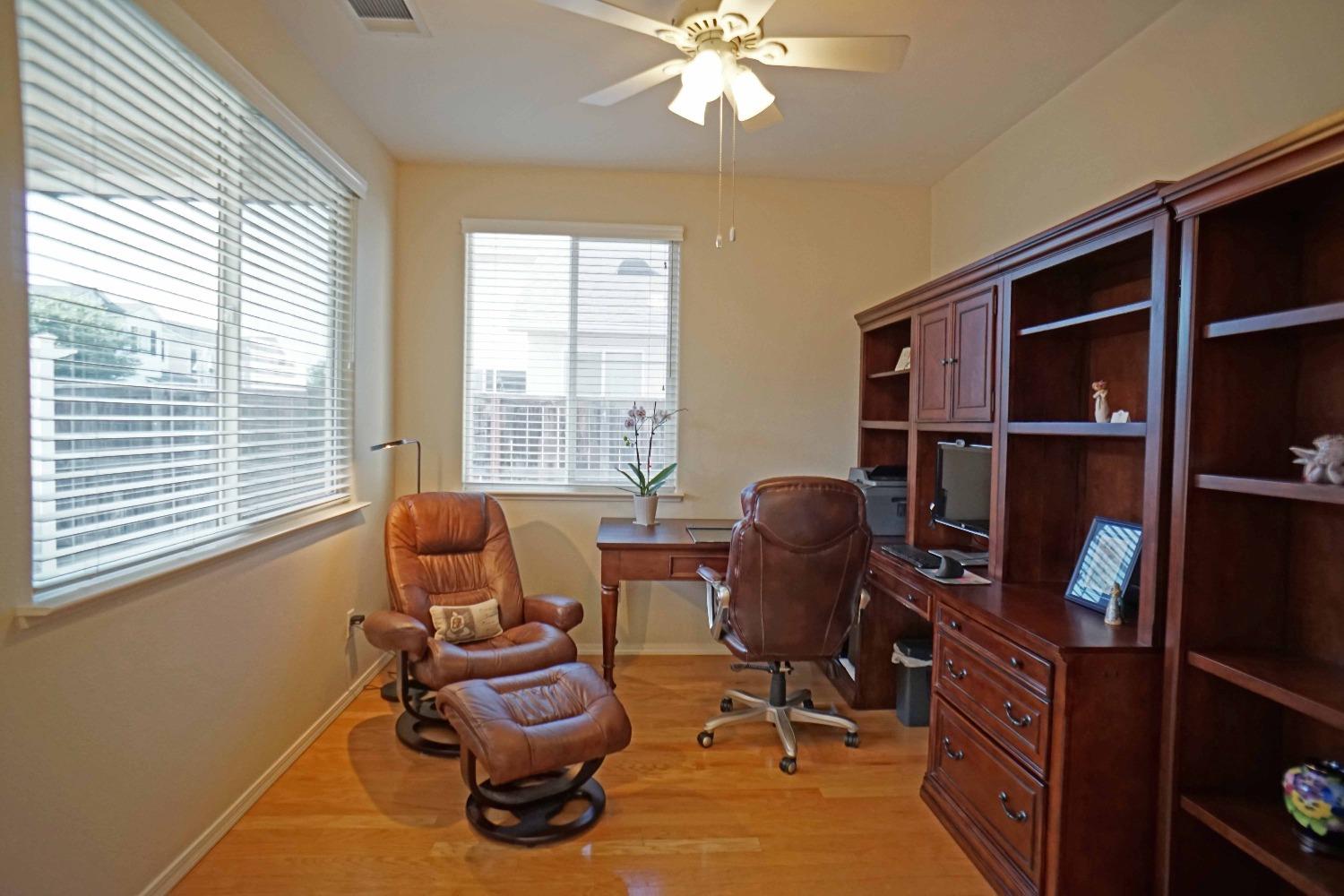 618 West Lisbon Lane Clovis, CA 93619 - Photo 10 of 26 a view of a workspace with furniture and a window