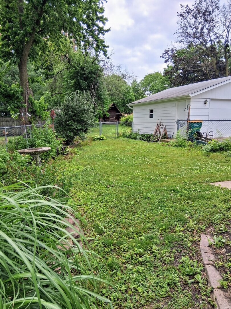 742 South 4th Street DeKalb, IL 60115 - Photo 37 of 46 a view of a house with backyard and garden