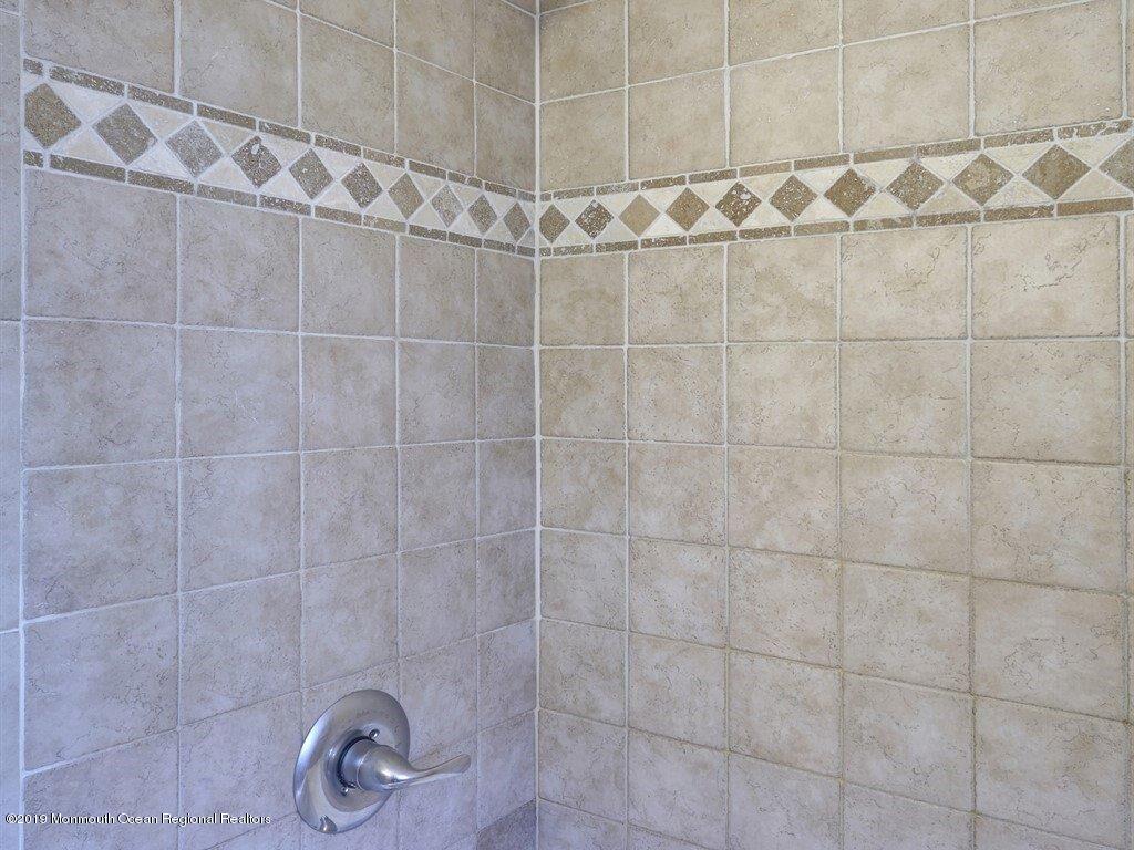 369 Old Squan Road Brick, NJ 08724 - Photo 17 of 30 Ungrade Tile in first floor bathroom