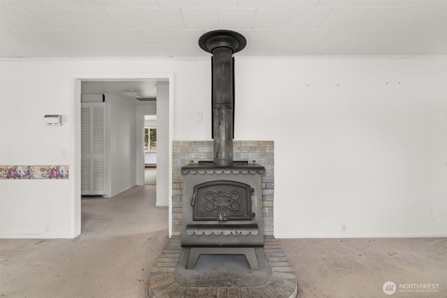 269 Kennedy Road Onalaska, WA 98570 - Photo 12 of 29 a view of a livingroom with a fireplace and a chandelier