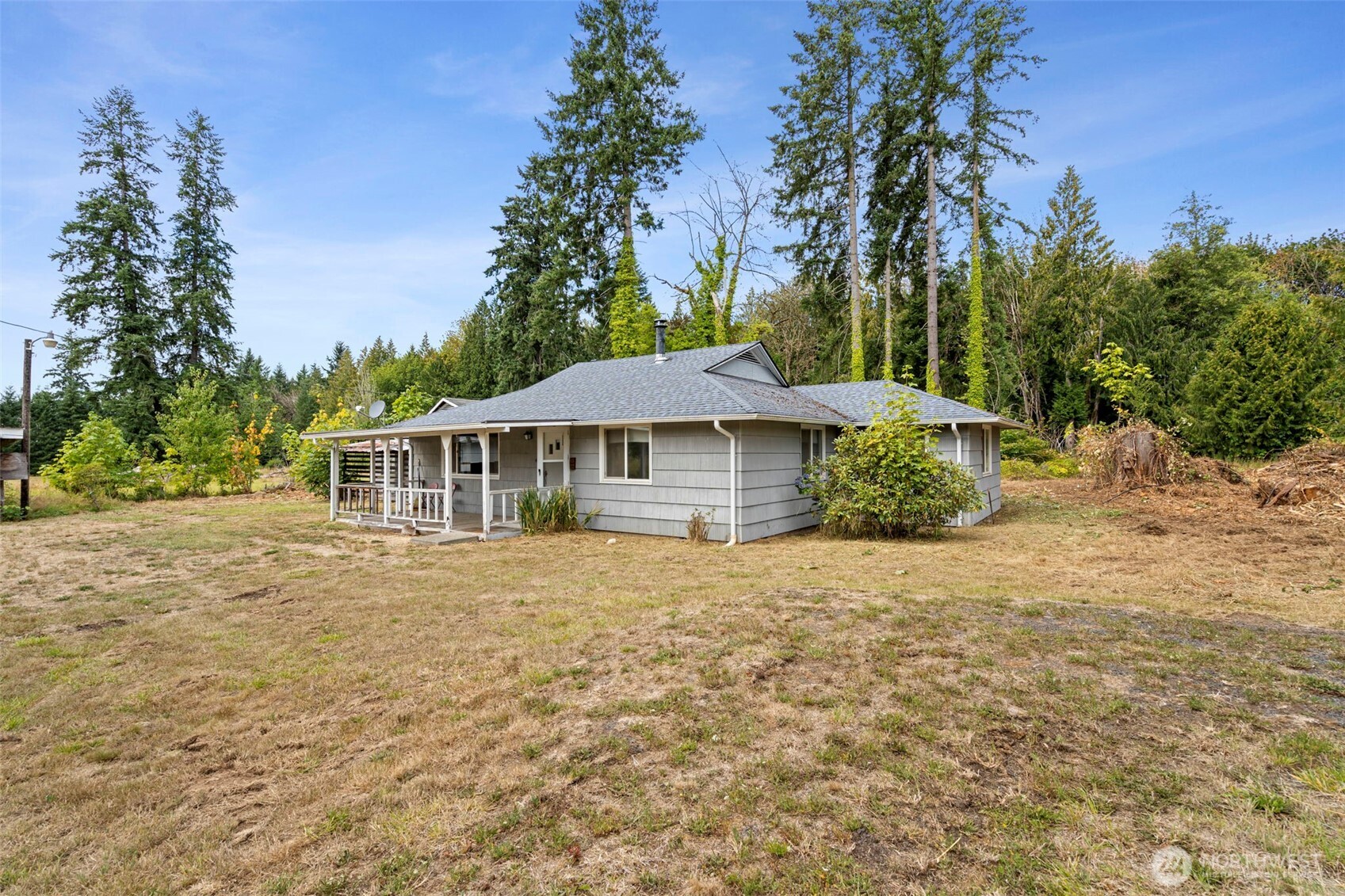 269 Kennedy Road Onalaska, WA 98570 - Photo 2 of 29 a front view of a house with a garden
